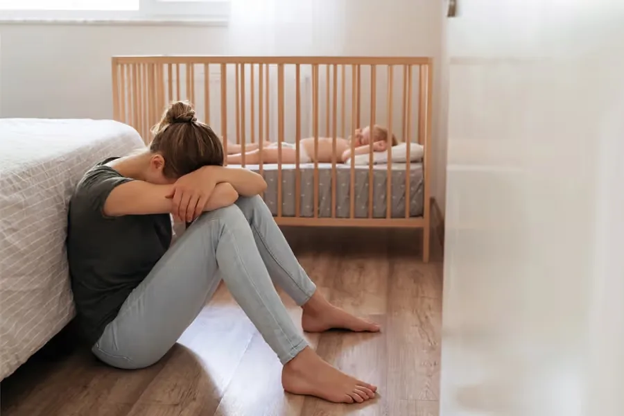 Woman holding her newborn baby