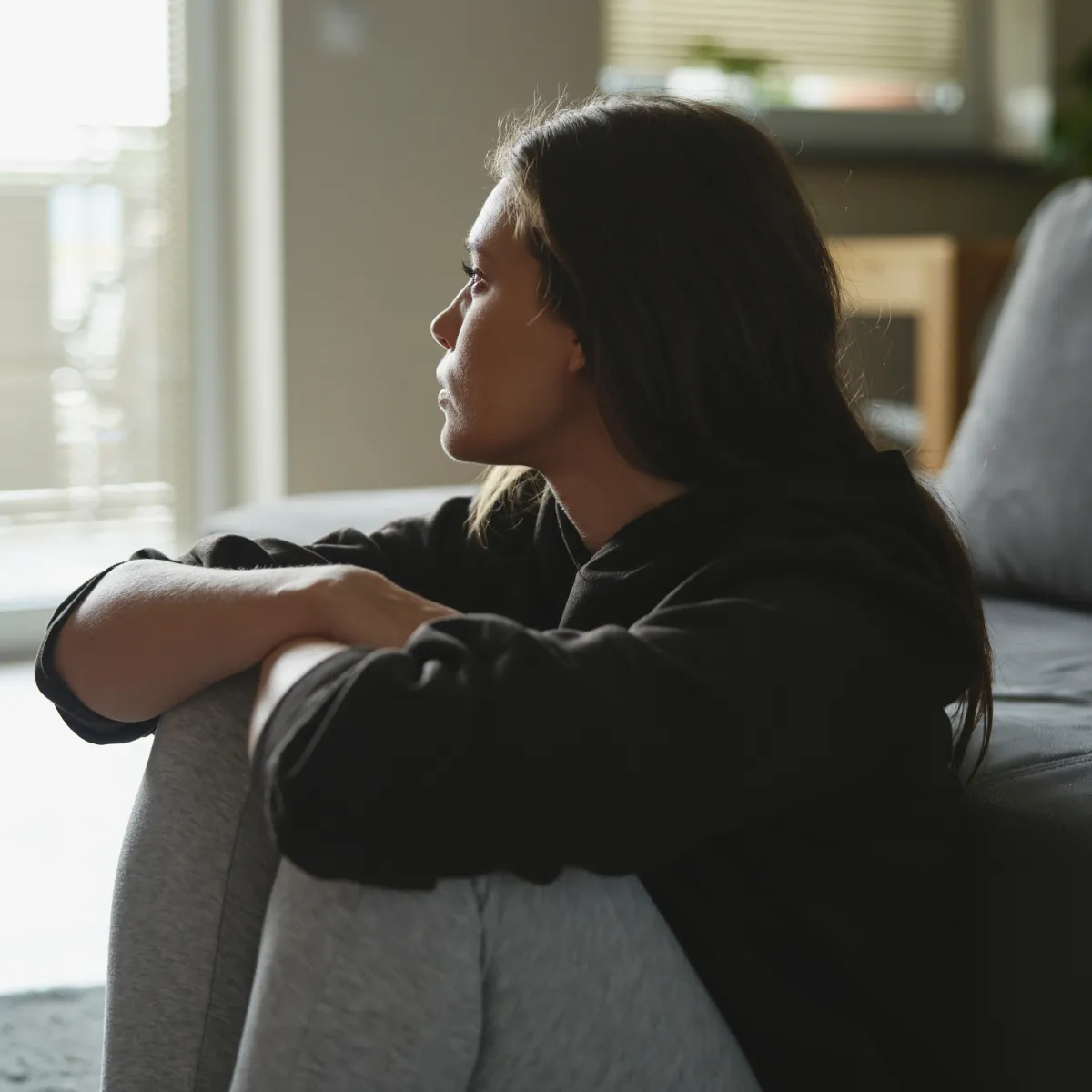 Woman looking reflective, representing the experience of depression