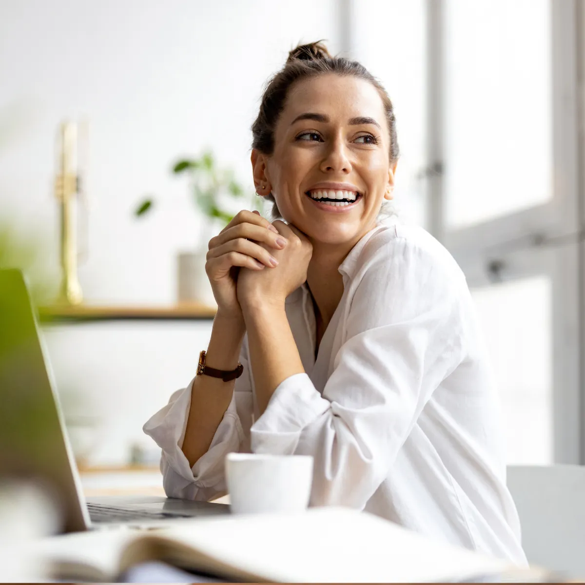 Woman having an online counselling session on her laptop