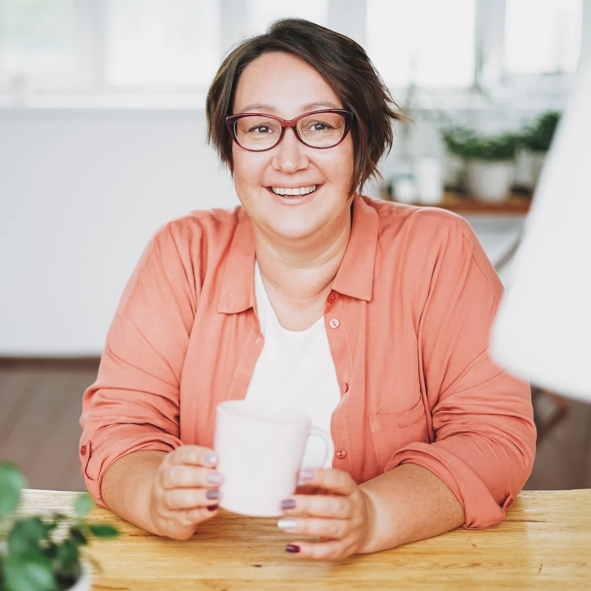 Woman in a quiet moment of reflection, weighed down by over-giving