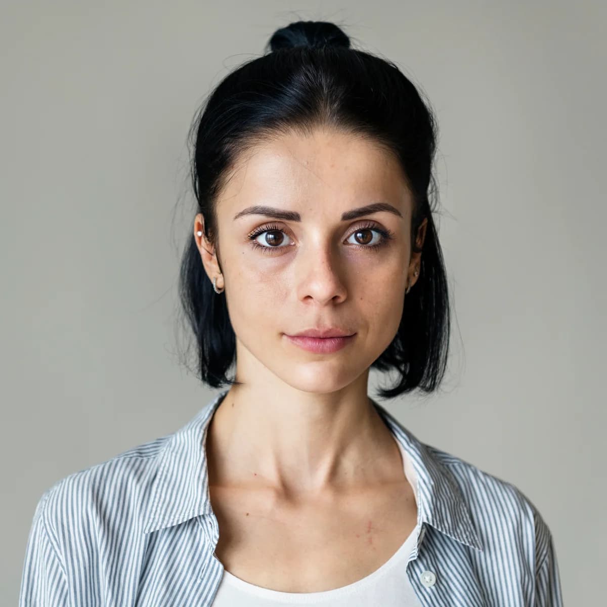 Woman sitting quietly in a thoughtful moment of self-reflection