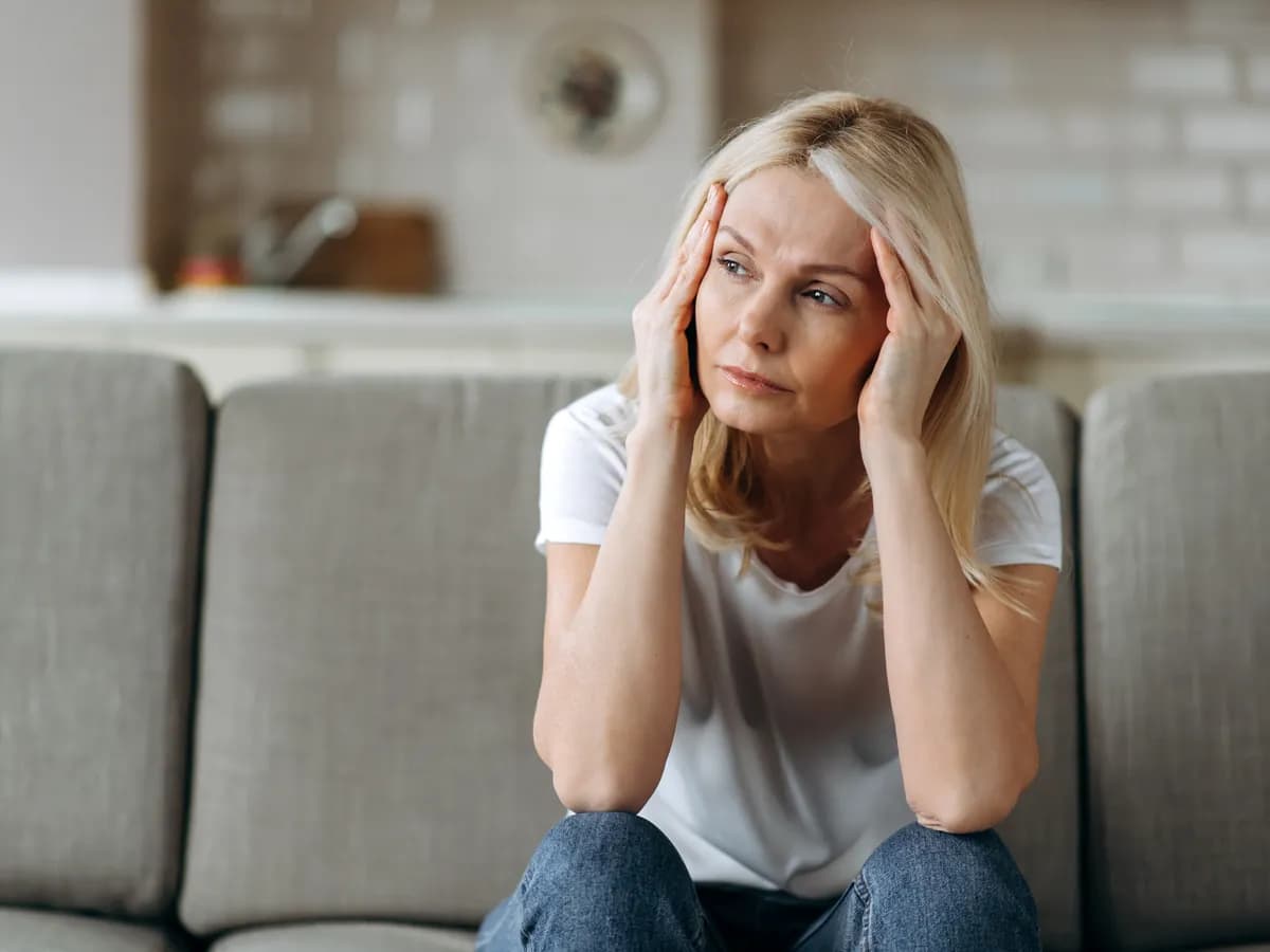Woman reflecting in therapy, exploring different parts of herself