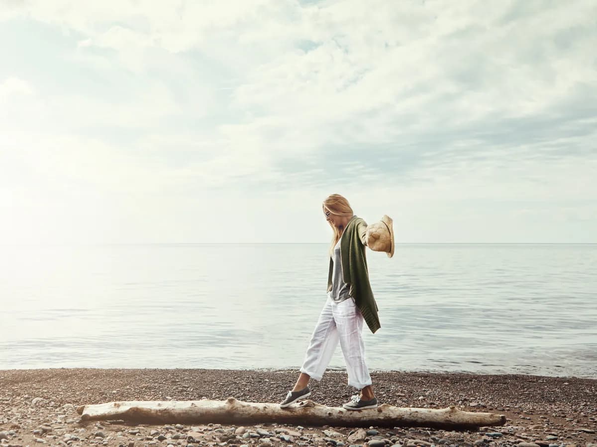 Woman reflecting thoughtfully, reshaping her own story
