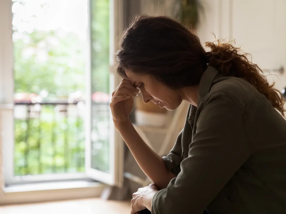 Woman reflecting on deeper emotions and past experiences