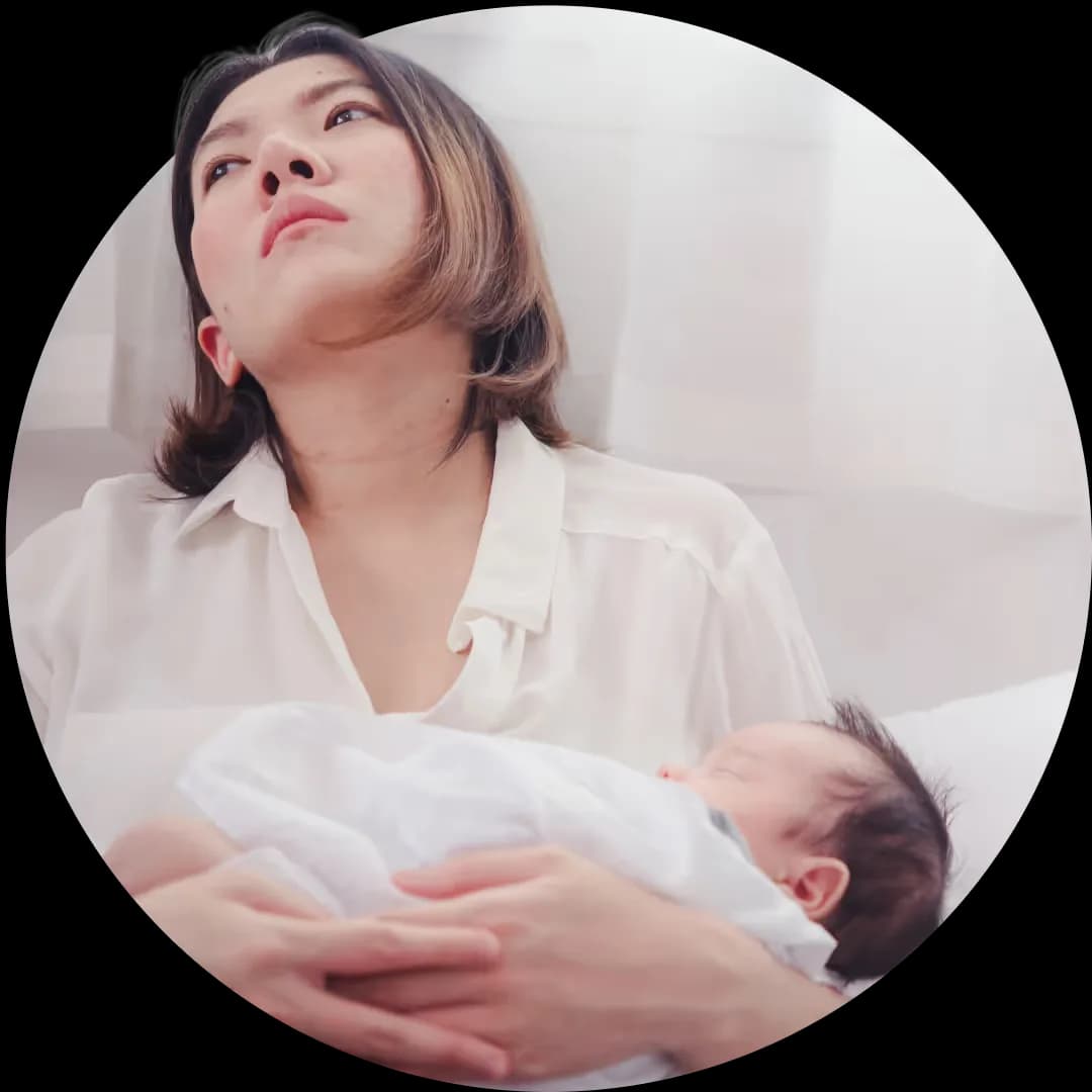 Woman with baby looking tired